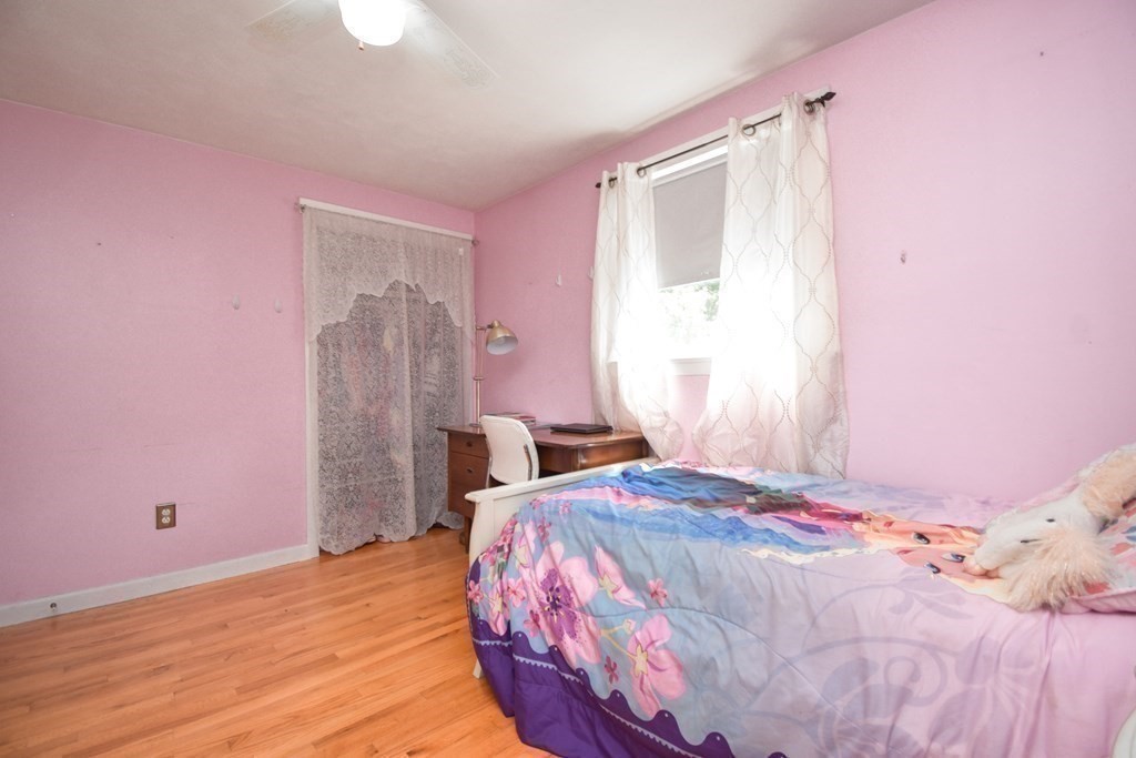 128 Tioga Street Springfield, MA 01128 - Photo 18 of 33 a bedroom with a bed and a window