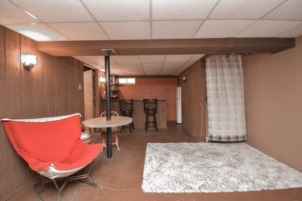 128 Tioga Street Springfield, MA 01128 - Photo 25 of 33 a kitchen with a table and chairs