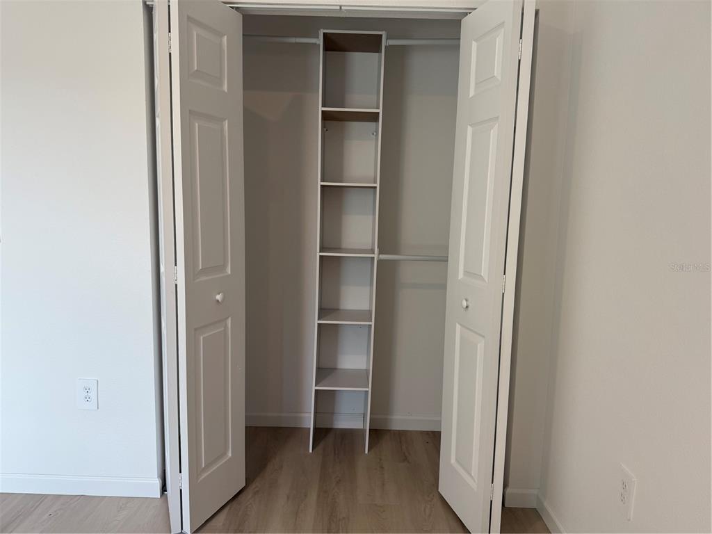 12847 Southwest 84th Terrace Road Ocala, FL 34473 - Photo 9 of 16 a view of walk in closet with empty racks