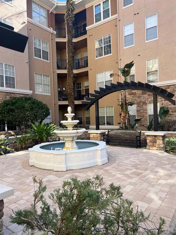 4221 West Spruce Street, Unit 2222 Tampa, FL 33607 - Photo 12 of 25 a view of a building with cars parked