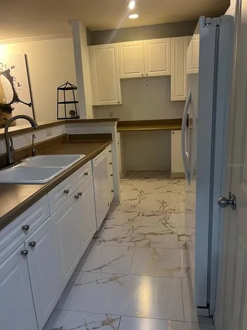 a kitchen with a sink and cabinets