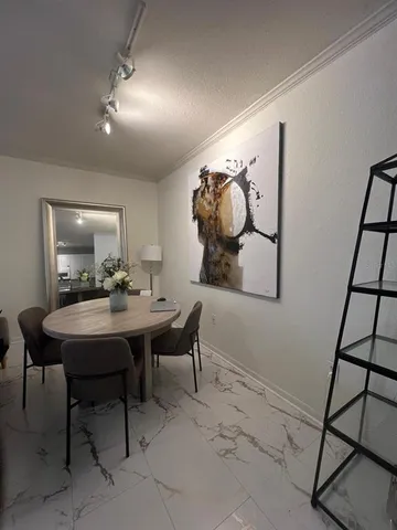 a view of a table and chairs in a room