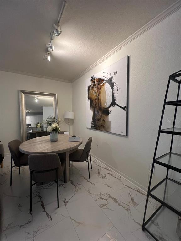 4221 West Spruce Street, Unit 2222 Tampa, FL 33607 - Photo 18 of 25 a view of a table and chairs in a room