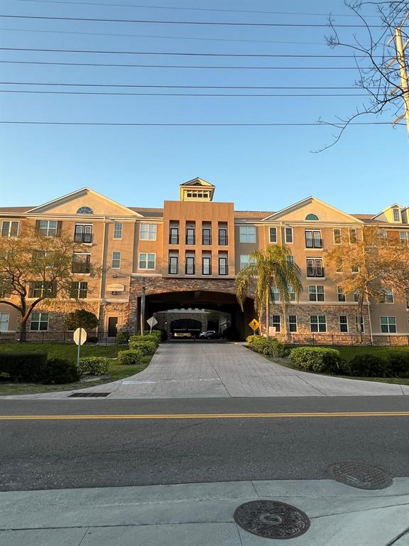 4221 West Spruce Street, Unit 2222 Tampa, FL 33607 - Photo 2 of 25 a view of a car park in front of a building