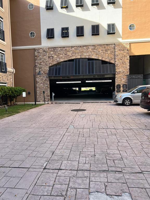 4221 West Spruce Street, Unit 2222 Tampa, FL 33607 - Photo 3 of 25 a view of building with car parked