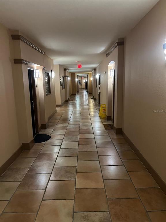 4221 West Spruce Street, Unit 2222 Tampa, FL 33607 - Photo 5 of 25 a view of a hallway with seating area