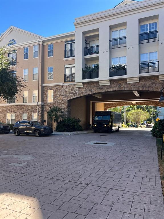 4221 West Spruce Street, Unit 2222 Tampa, FL 33607 - Photo 8 of 25 a view of a car parked in front of a building