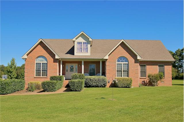 3944 Flewellyn Road Springfield, TN 37172 - Photo 1 of 20 a front view of a house with a yard and garage