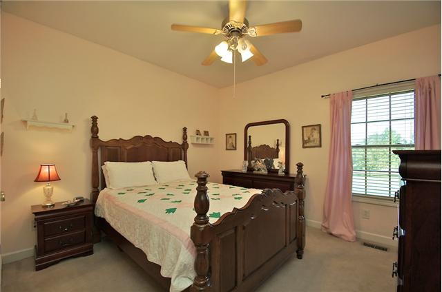 3944 Flewellyn Road Springfield, TN 37172 - Photo 11 of 20 a bed sitting in a bedroom next to a window