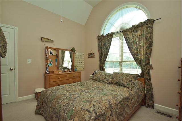 3944 Flewellyn Road Springfield, TN 37172 - Photo 12 of 20 a spacious bedroom with a bed and a dresser