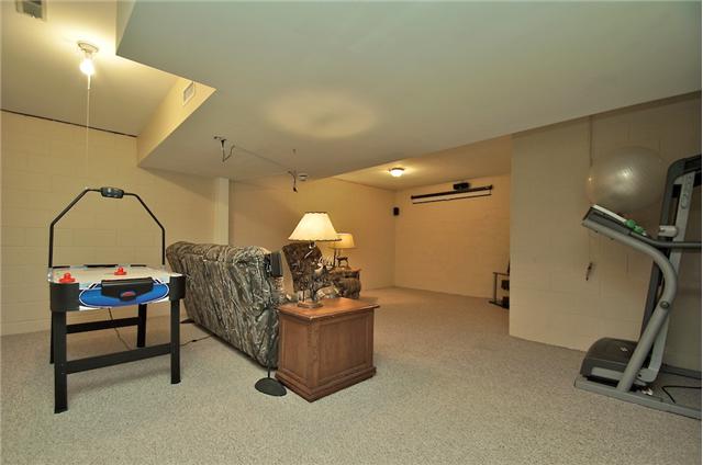 3944 Flewellyn Road Springfield, TN 37172 - Photo 14 of 20 a living room with furniture a pool table and a flat screen tv