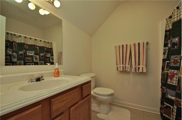 3944 Flewellyn Road Springfield, TN 37172 - Photo 16 of 20 a bathroom with a sink and a large mirror