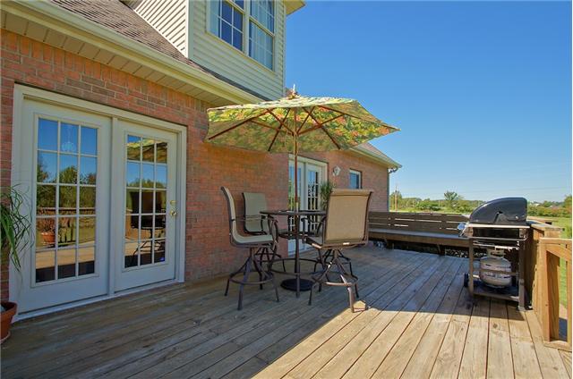 3944 Flewellyn Road Springfield, TN 37172 - Photo 17 of 20 a view of a roof deck with table and chairs
