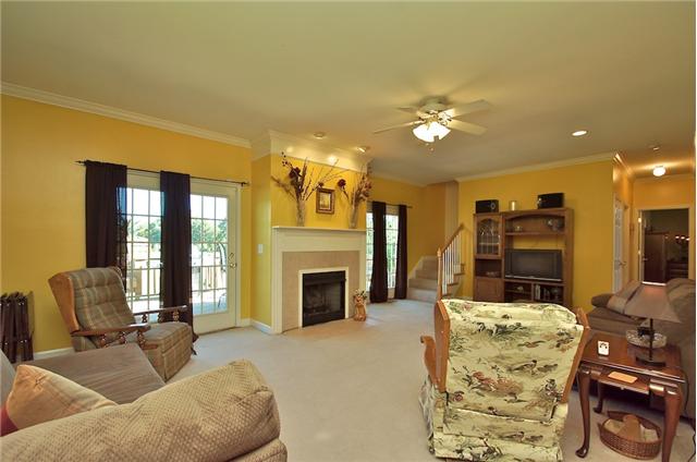 3944 Flewellyn Road Springfield, TN 37172 - Photo 4 of 20 a living room with furniture fireplace and a flat screen tv