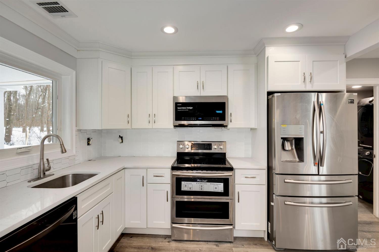 81 Fresh Ponds Road Monroe Township, NJ 08831 - Photo 11 of 30 kitchen with custom cabinetry, stainless steel appliance package