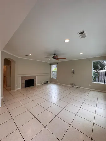 a kitchen with kitchen island granite countertop a refrigerator stove top oven and sink
