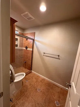 a bathroom with a sink vanity and mirror