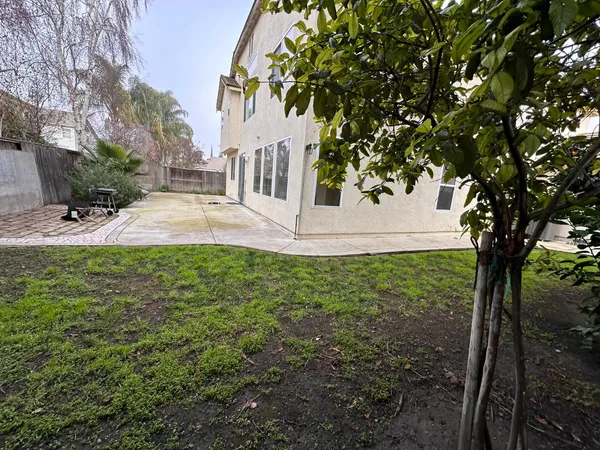 a backyard of a house with lots of green space