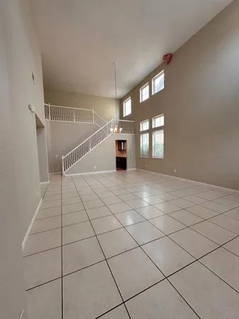 a view of a bedroom with furniture and wooden floor