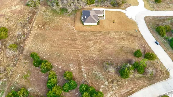 a view of yard along with trees