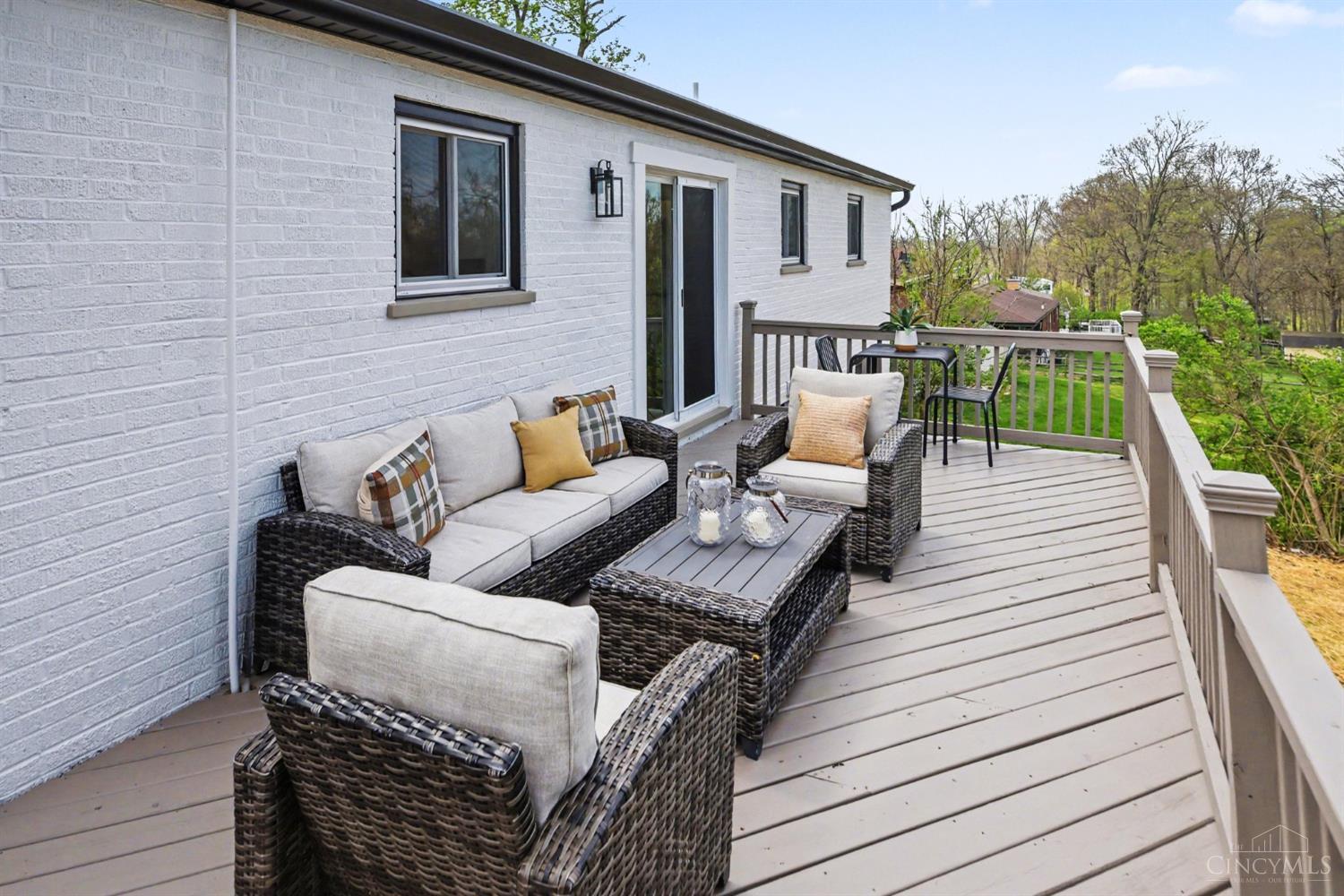 7230 Barret Road West Chester, OH 45069 - Photo 32 of 50 Step outside — whether through the dining room or the basement — to a large, freshly landscaped backyard. Featuring an expansive elevated deck and new firepit area with boulder border — it’s the perfect space to unwind or entertain