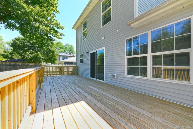 a view of deck with a large trees