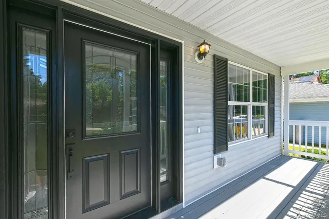a view of a balcony with wooden floor