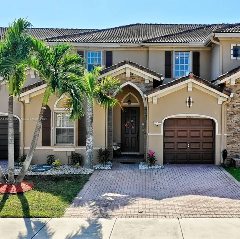 a view of a car park in front of house