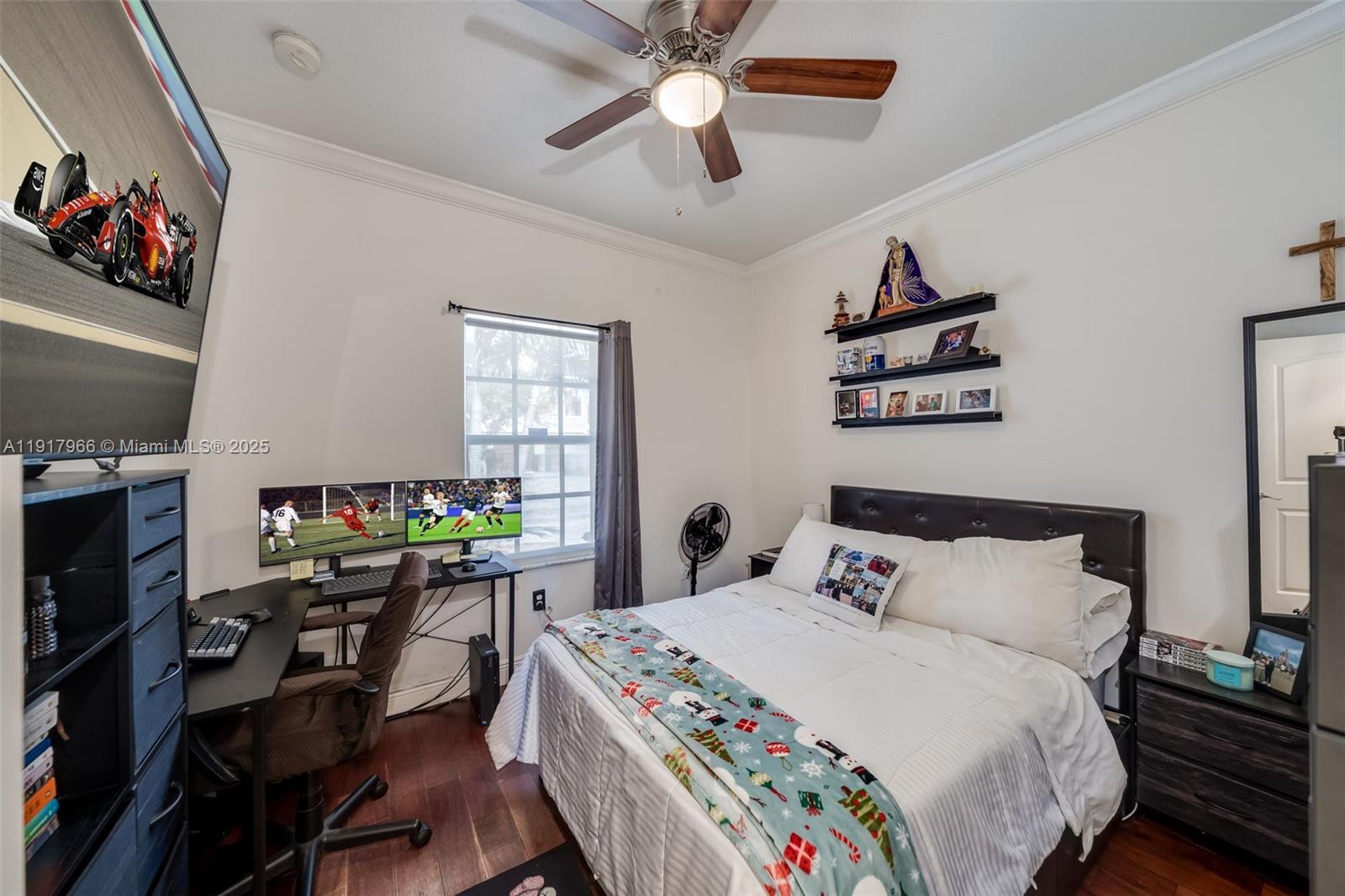 15242 Southwest 8th Way Miami, FL 33194 - Photo 16 of 62 a bedroom with a bed a computer on a desk and chair