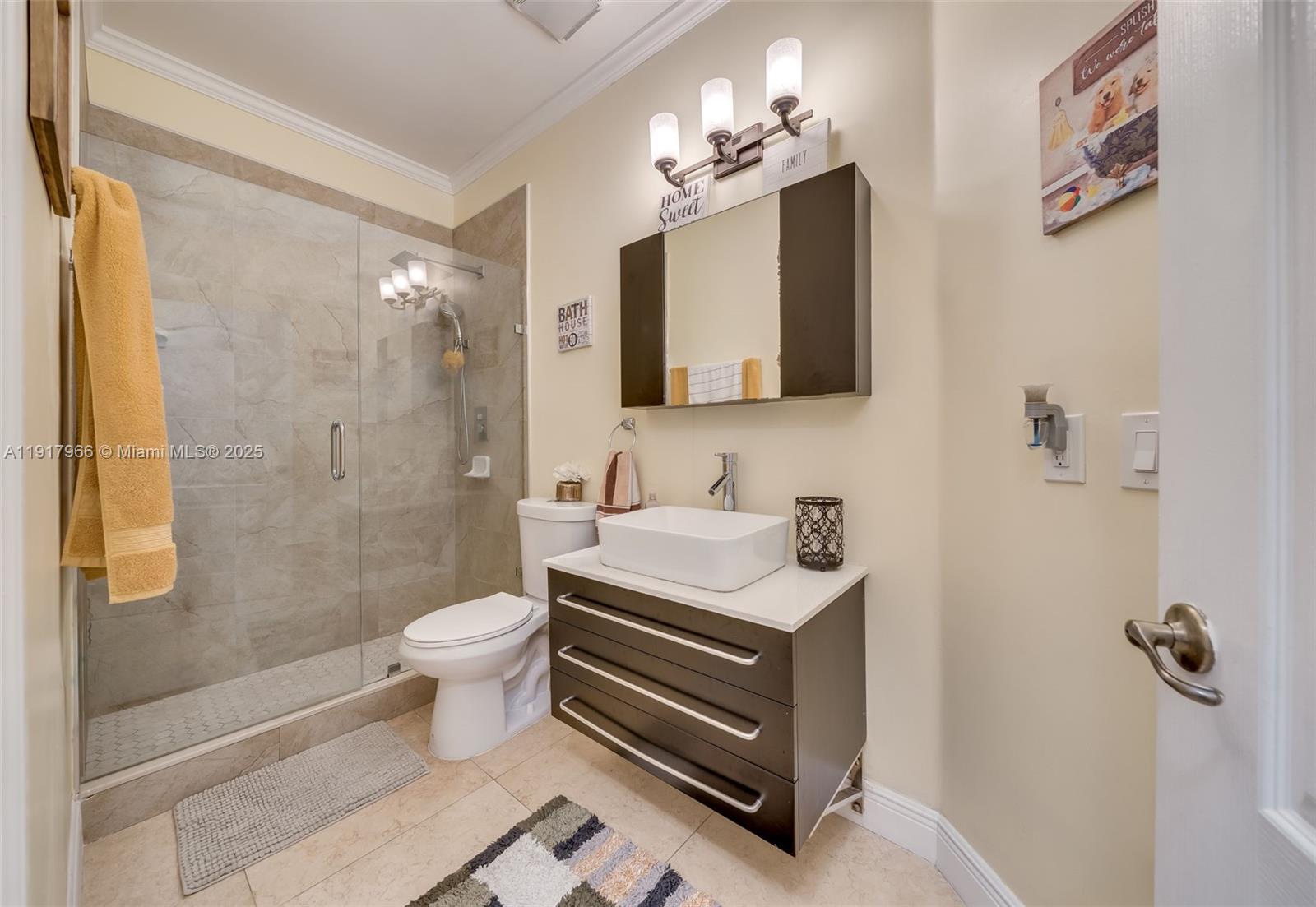 15242 Southwest 8th Way Miami, FL 33194 - Photo 17 of 62 a bathroom with a sink a toilet and shower