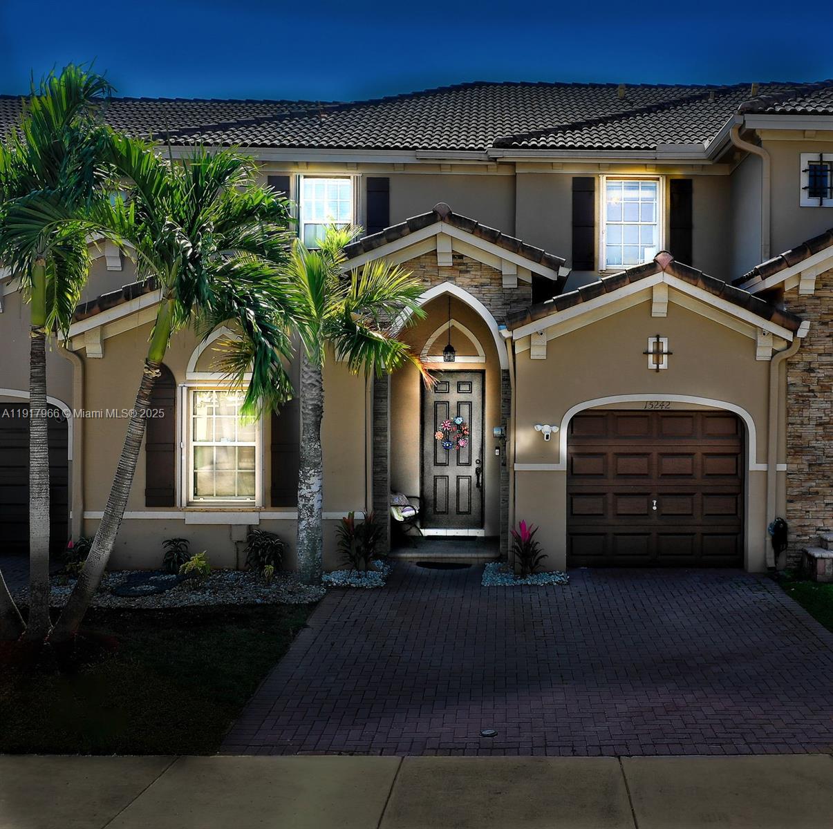 15242 Southwest 8th Way Miami, FL 33194 - Photo 2 of 62 a view of a car park in front of house