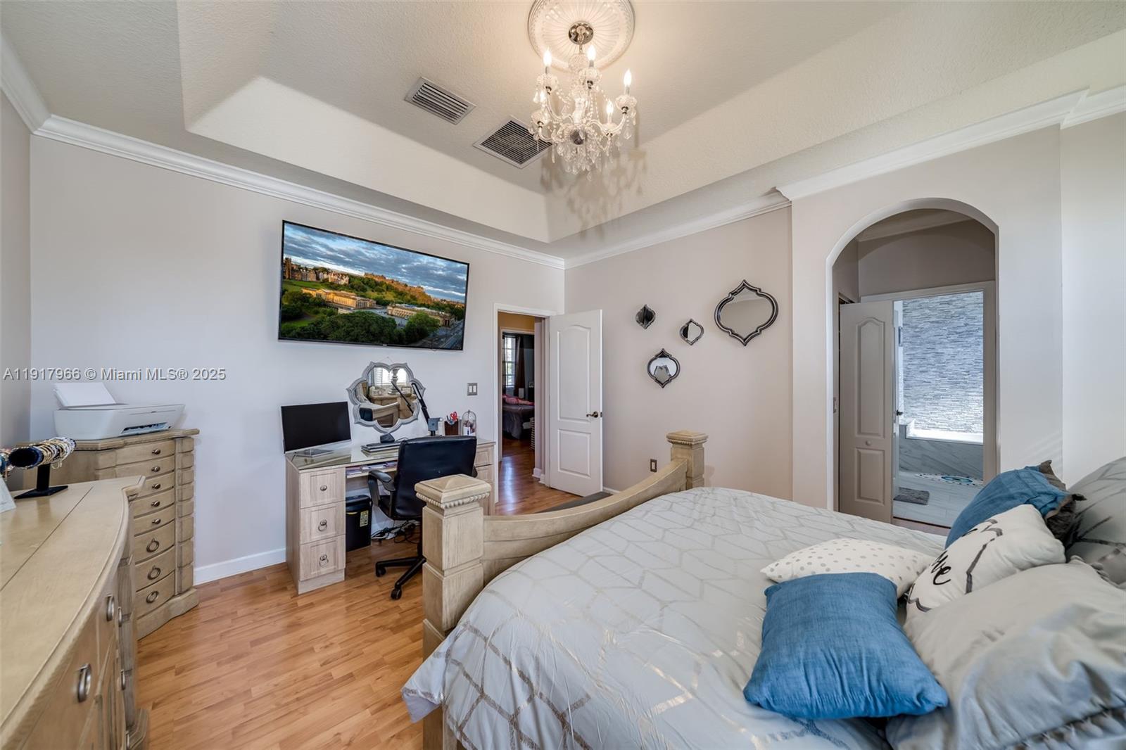 15242 Southwest 8th Way Miami, FL 33194 - Photo 23 of 62 a bedroom with a bed window and a flat screen tv