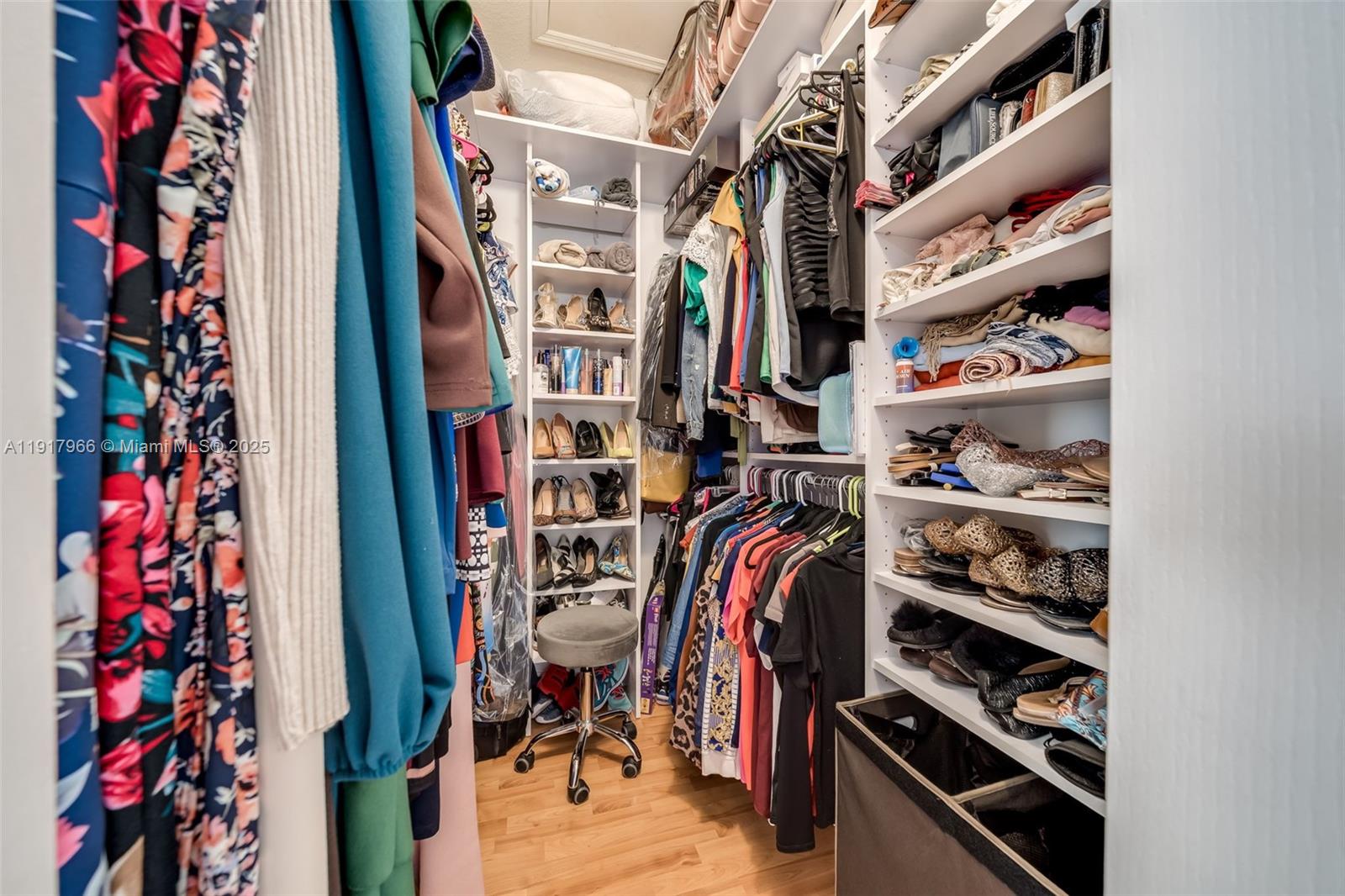 15242 Southwest 8th Way Miami, FL 33194 - Photo 30 of 62 a view of walk in closet with clothes and shoes