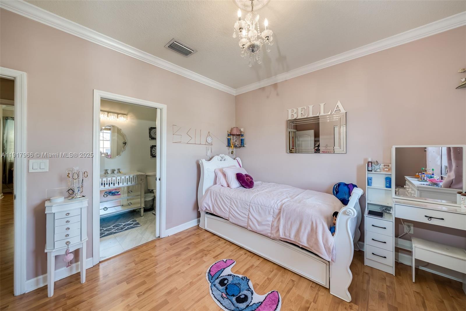 15242 Southwest 8th Way Miami, FL 33194 - Photo 33 of 62 a bedroom with a bed and a chandelier