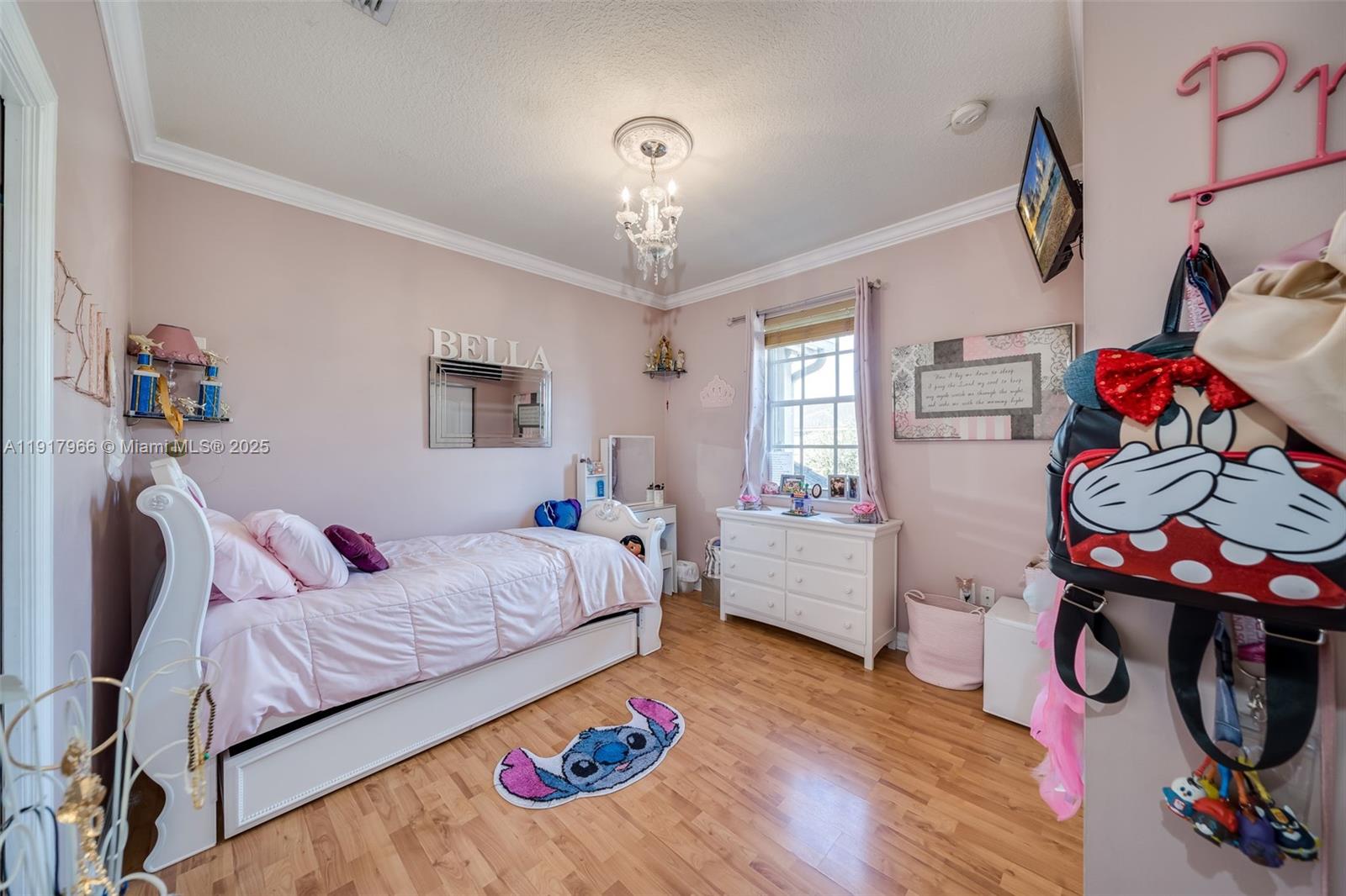 15242 Southwest 8th Way Miami, FL 33194 - Photo 35 of 62 a bedroom with furniture and a wooden floor