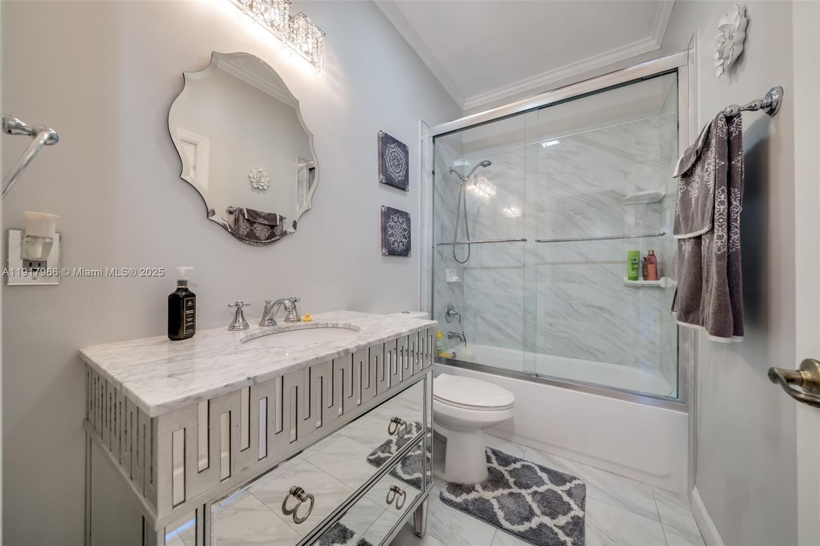 15242 Southwest 8th Way Miami, FL 33194 - Photo 37 of 62 a bathroom with a sink a toilet and shower