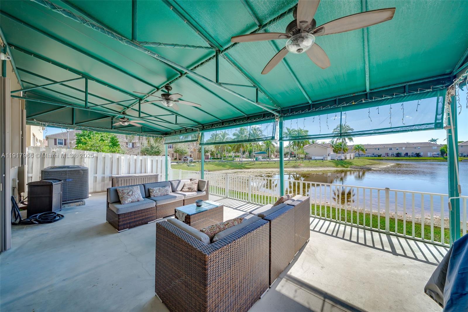 15242 Southwest 8th Way Miami, FL 33194 - Photo 39 of 62 a view of a patio with a table chairs and a umbrella