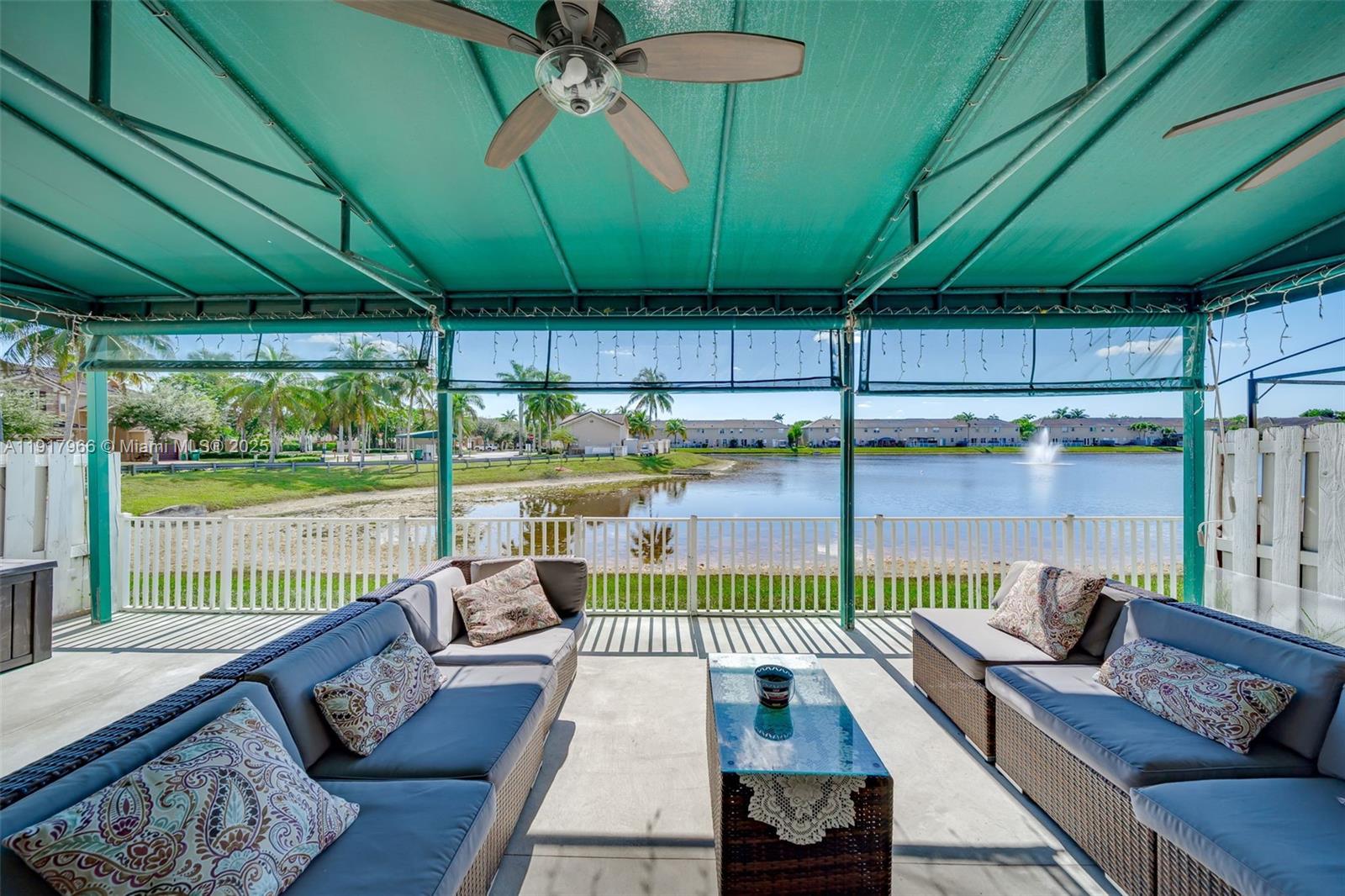 15242 Southwest 8th Way Miami, FL 33194 - Photo 41 of 62 a view of a patio with couches chairs and a potted plant