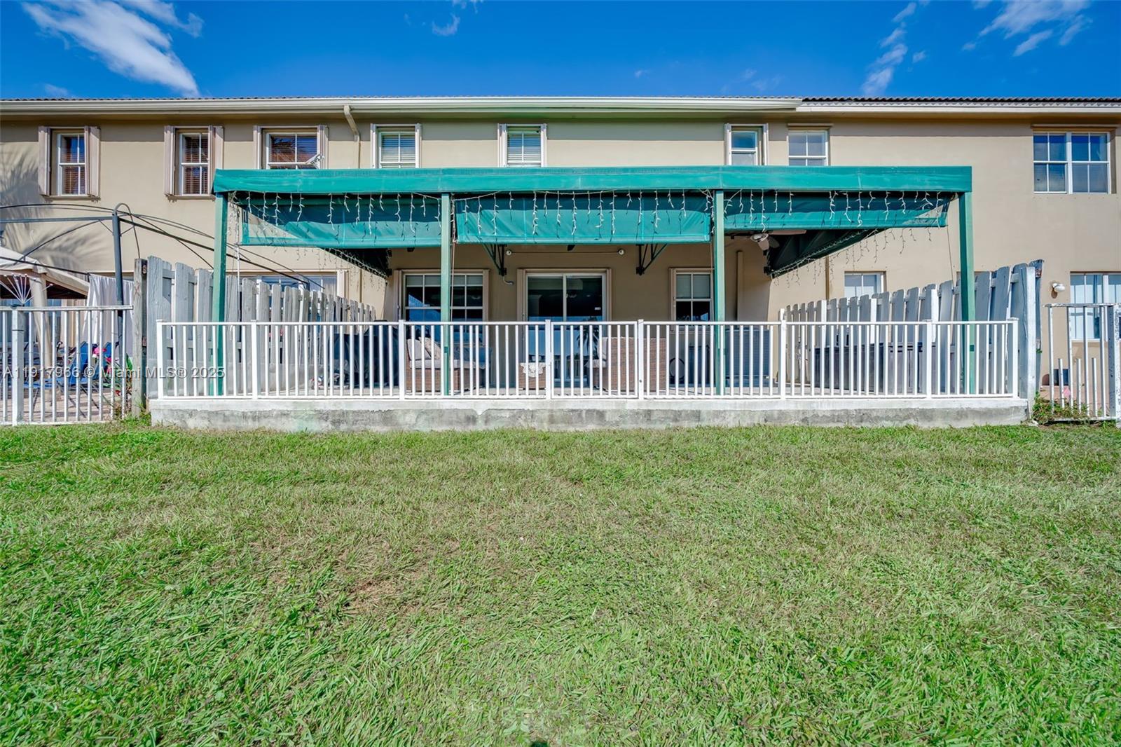 15242 Southwest 8th Way Miami, FL 33194 - Photo 43 of 62 a front view of a house with balcony