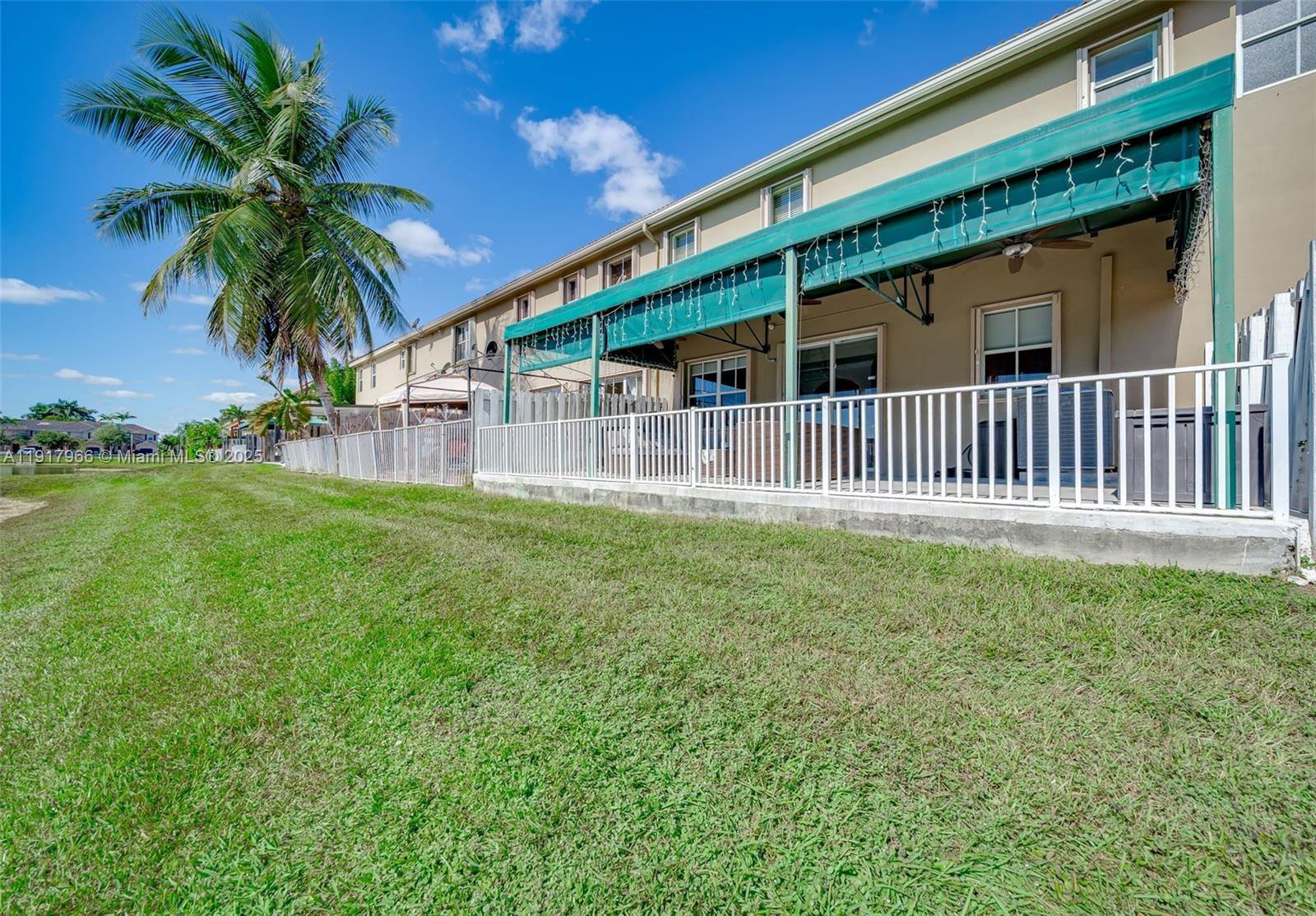 15242 Southwest 8th Way Miami, FL 33194 - Photo 44 of 62 a front view of a house with garden