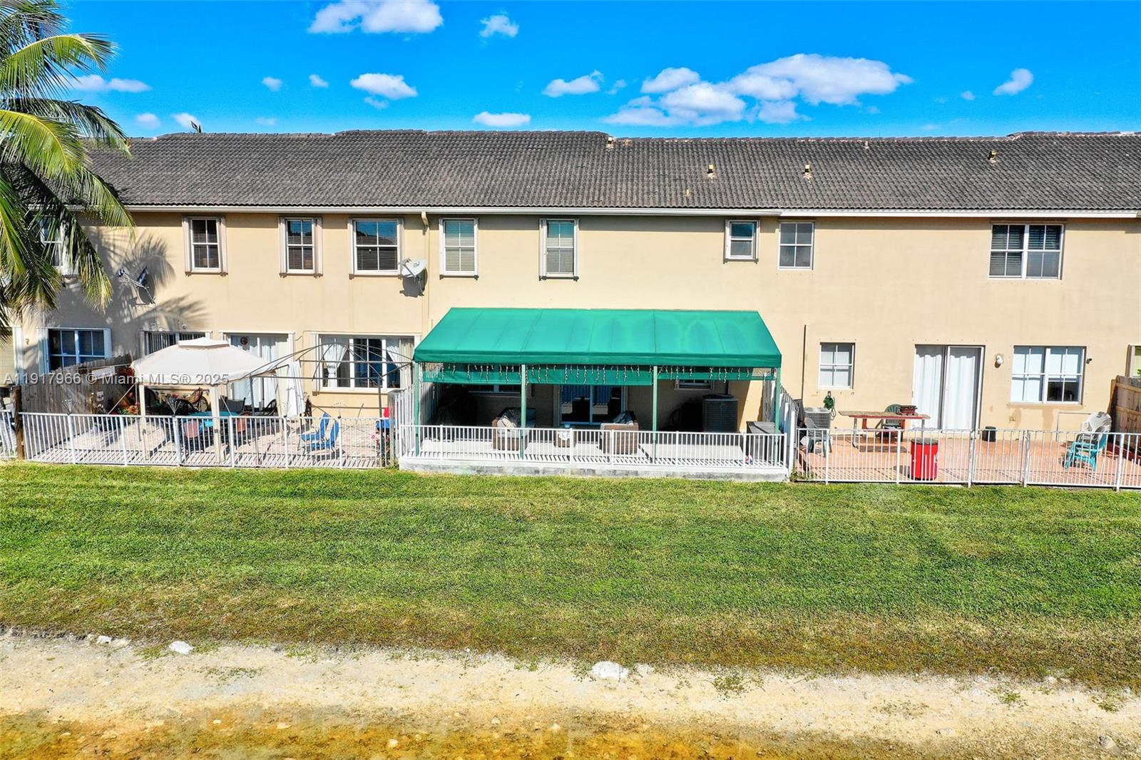 15242 Southwest 8th Way Miami, FL 33194 - Photo 46 of 62 a view of a house with a yard porch and sitting area
