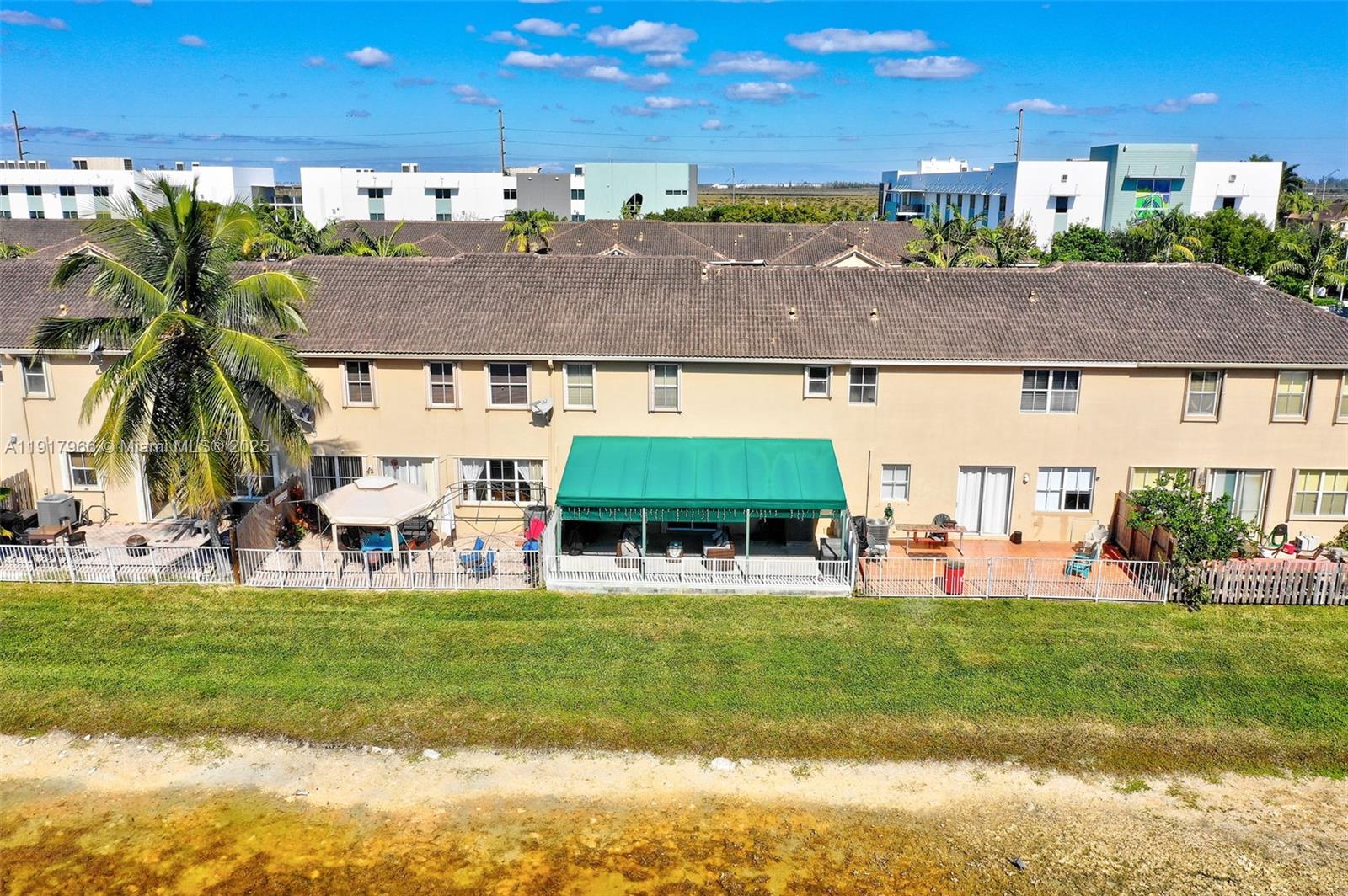 15242 Southwest 8th Way Miami, FL 33194 - Photo 47 of 62 a view of a house with a swimming pool