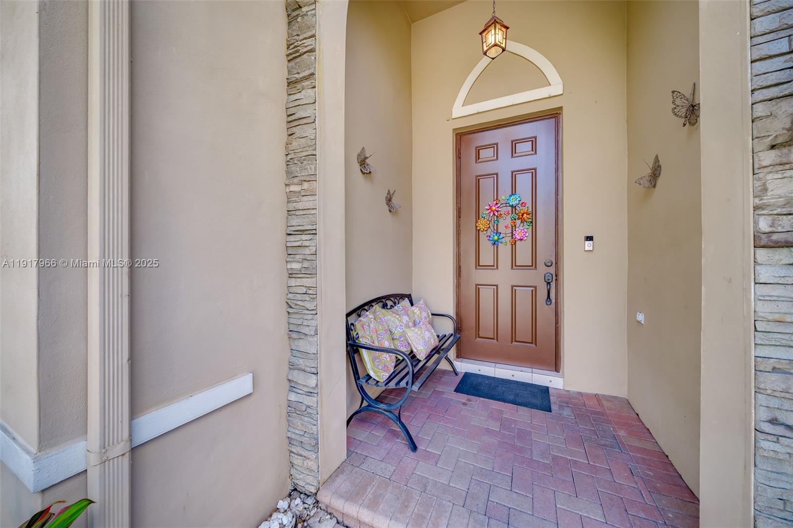15242 Southwest 8th Way Miami, FL 33194 - Photo 5 of 62 a view of an entryway with wooden floor