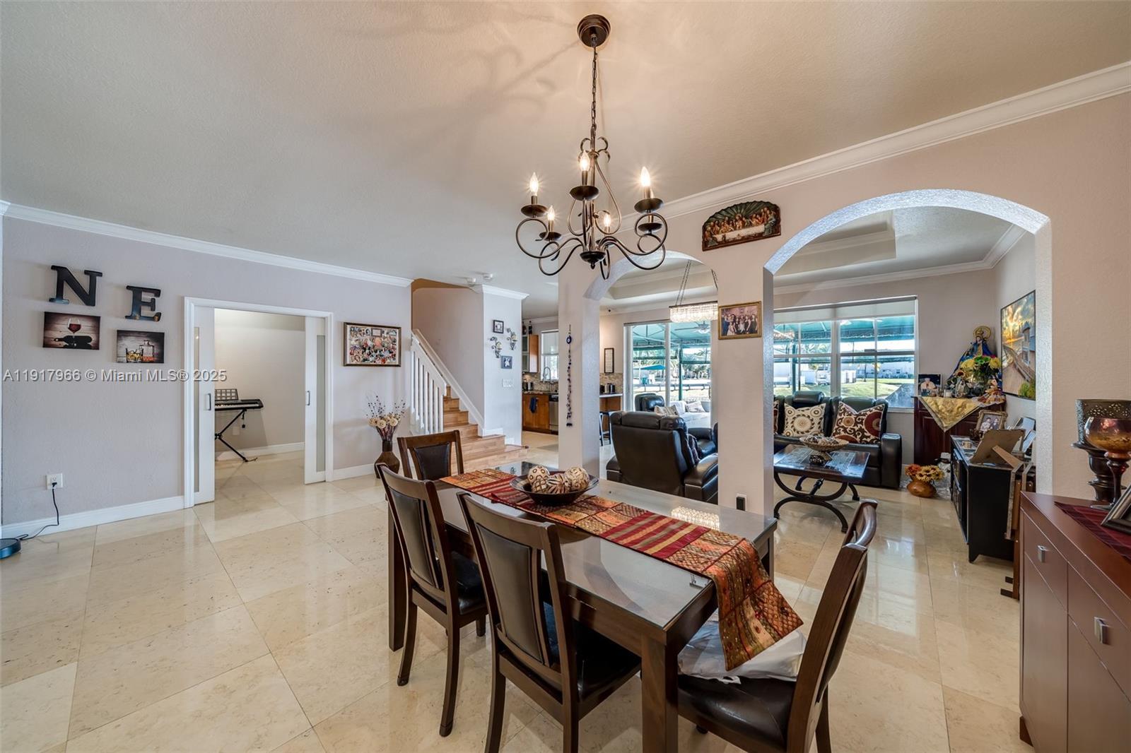 15242 Southwest 8th Way Miami, FL 33194 - Photo 9 of 62 a view of a dining room with furniture window and wooden floor