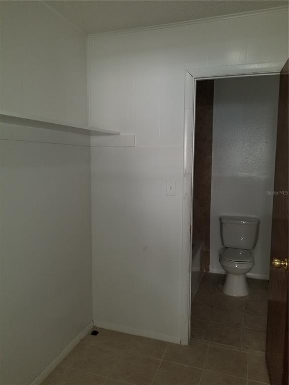 1306 East 137th Avenue, Unit C Tampa, FL 33613 - Photo 10 of 10 a bathroom with a toilet
