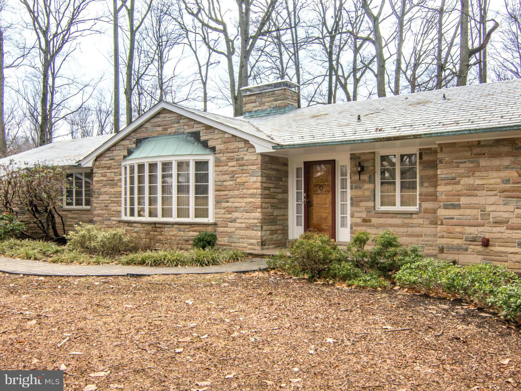 801 Huntsman Road Baltimore, MD 21286 - Photo 1 of 22 a front view of a house with a garden