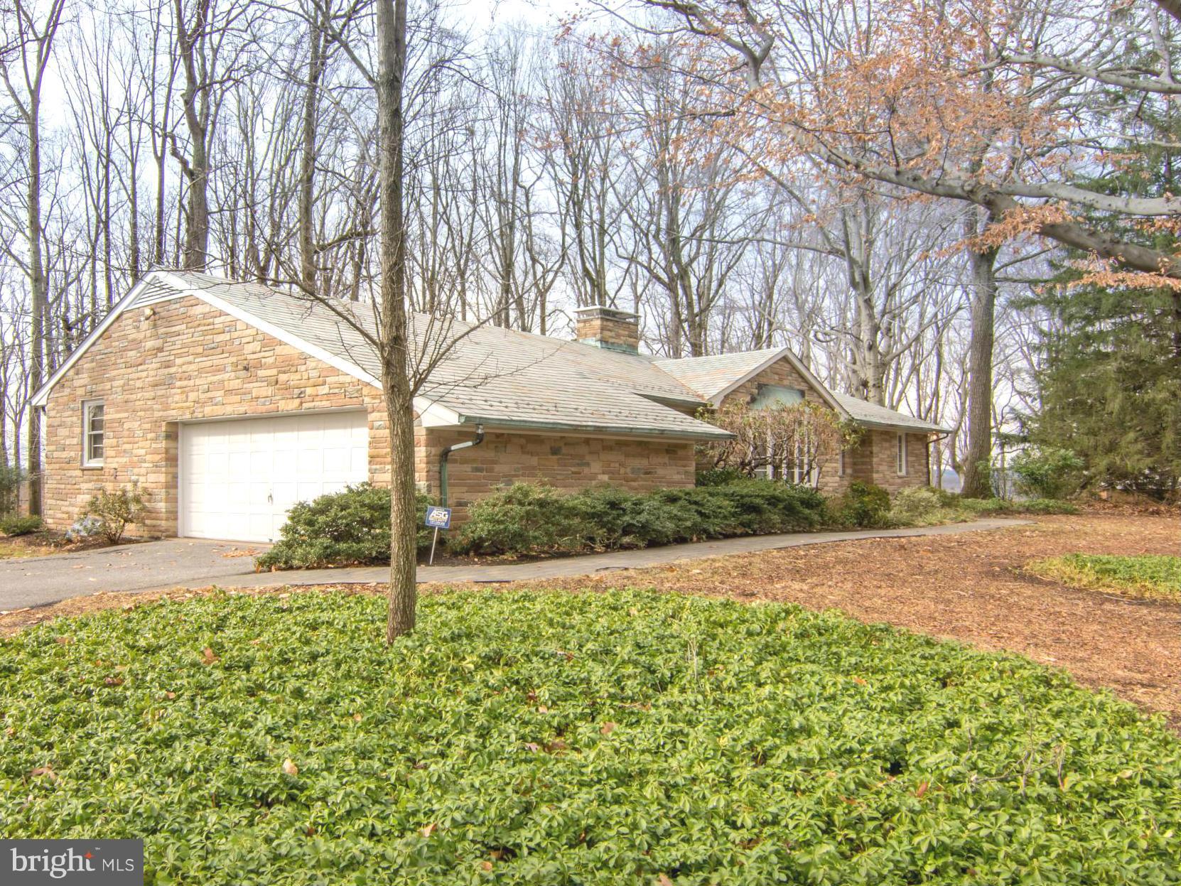 801 Huntsman Road Baltimore, MD 21286 - Photo 2 of 22 a front view of a house with a yard and garage