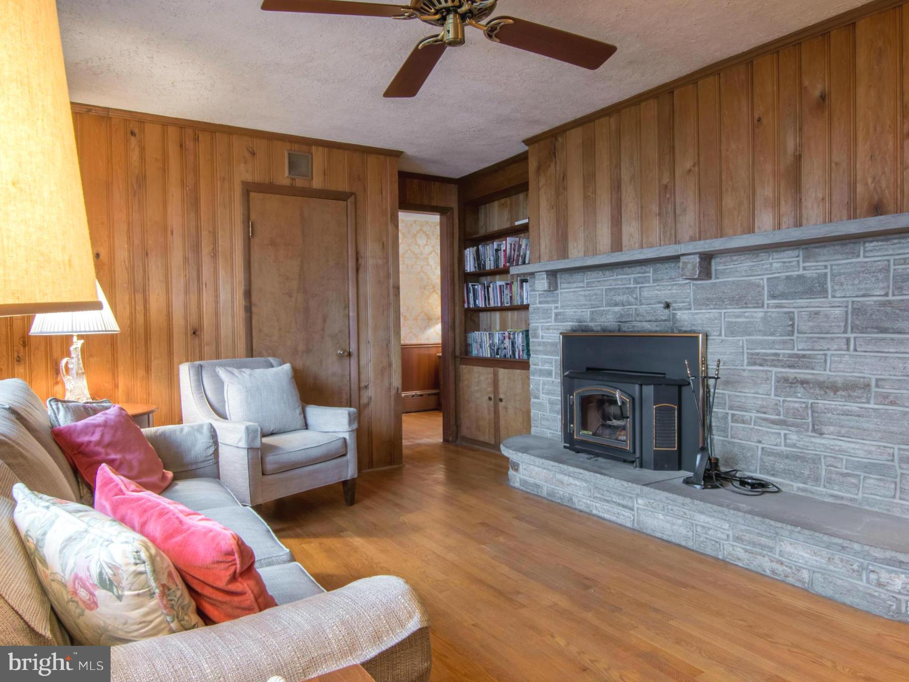 801 Huntsman Road Baltimore, MD 21286 - Photo 11 of 22 a living room with furniture and a fireplace