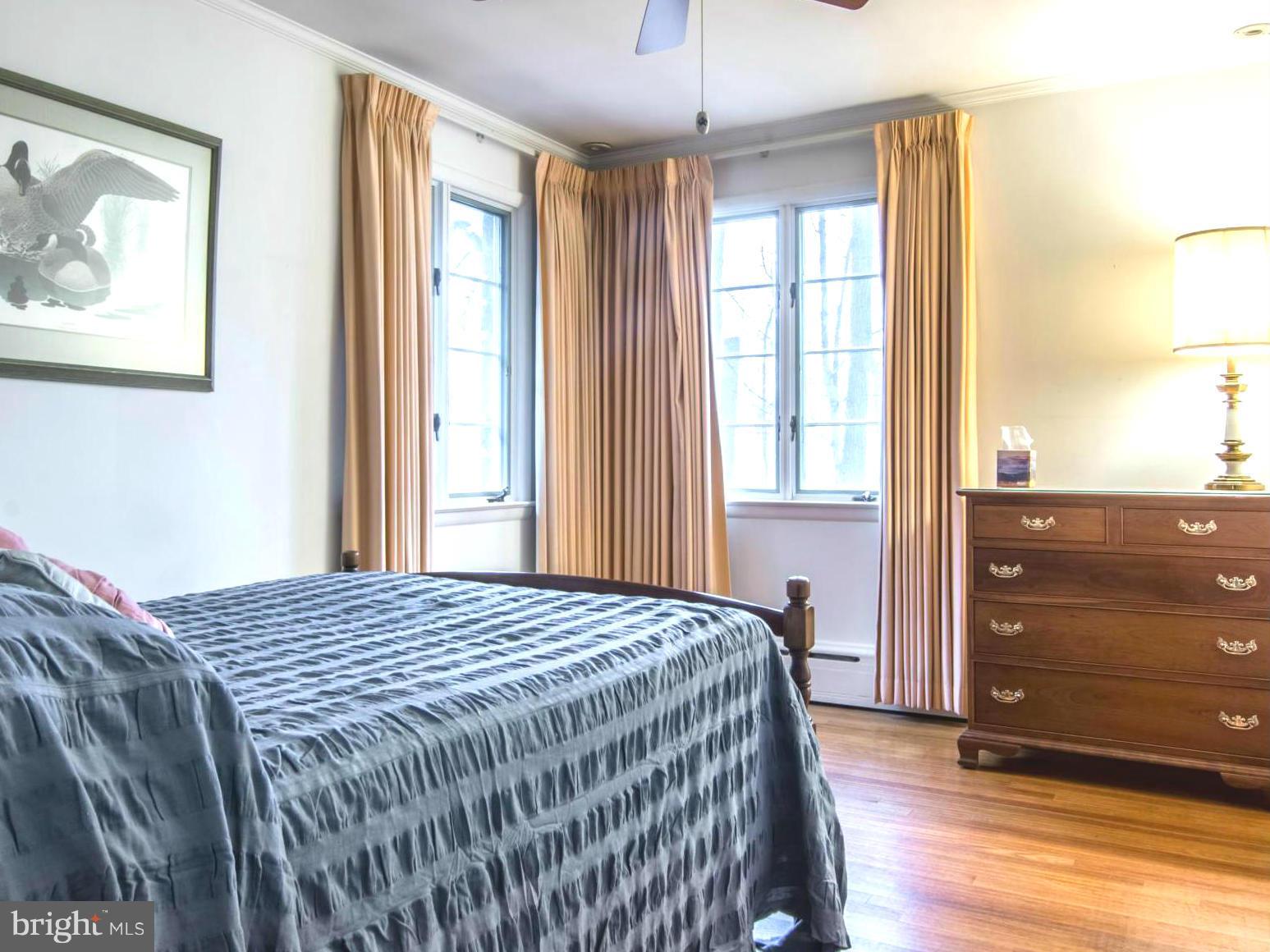 801 Huntsman Road Baltimore, MD 21286 - Photo 13 of 22 a bedroom with a bed and a window