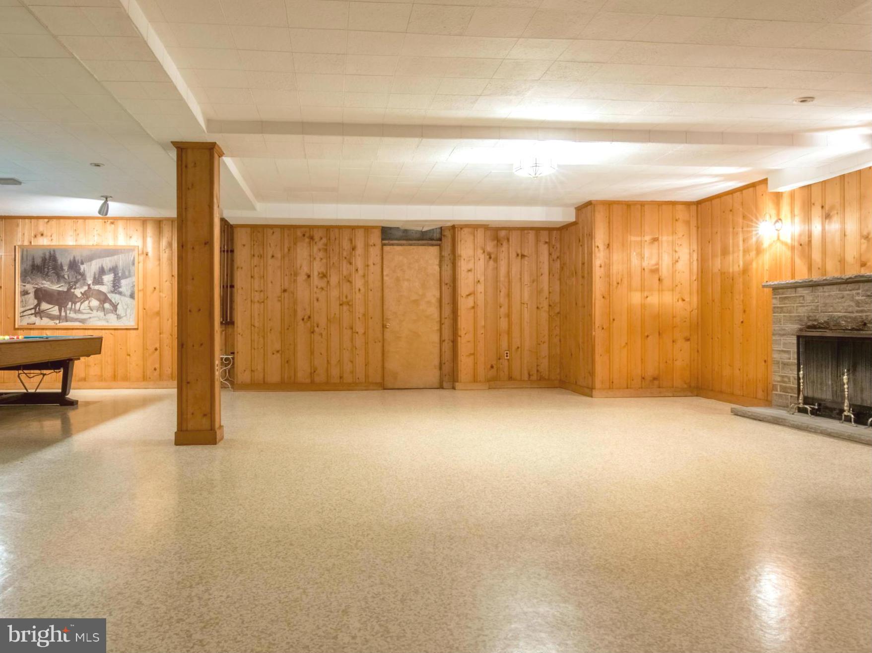 801 Huntsman Road Baltimore, MD 21286 - Photo 20 of 22 an empty room with furniture and a fireplace